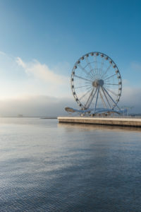 Azerbaijan, Baku, Bulvar Promenade, Baku Eye Ferris Wheel with morning fog, dawn Azerbaijan, Baku, Bulvar Promenade, Baku Eye Ferris Wheel with morning fog, dawn